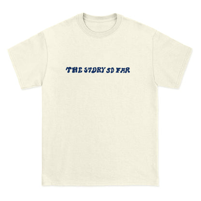A Comfort Colors off-white tee from The Story So Far, featuring the band name in bold wavy blue letters across the chest—a must-have for fans of branded merchandise.