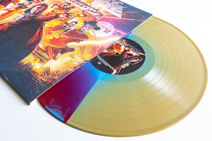 A multicolored Galactic Empire Soundtrack LP, mostly transparent gold with vivid red and blue accents, is partially pulled from its illustrated album cover featuring striking futuristic and retro artwork.