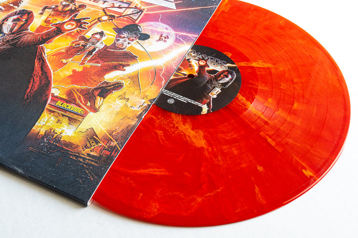 A vibrant Cinemetal Eruption Marble Vinyl from Galactic Empire partially slides out of its illustrated sleeve, showcasing masked figures and neon-lit, retro-futuristic art—a must-have limited edition for soundtrack album collectors.