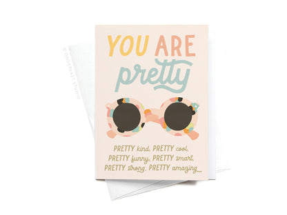 The Onderkast Studio You Are Pretty Sunglasses Sticker Greeting Card features a colorful sunglasses design and playful text on thick white card stock, paired with a white envelope.