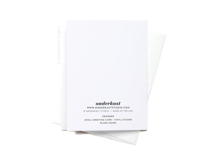 The You Are Pretty Sunglasses Sticker Greeting Card by Onderkast Studio is printed on thick white card stock with brand and website details on the back, shown atop a white envelope against a white background.